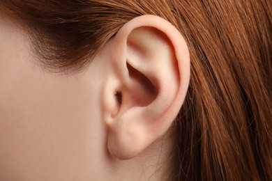 Photo of Closeup view of woman, focus on ear