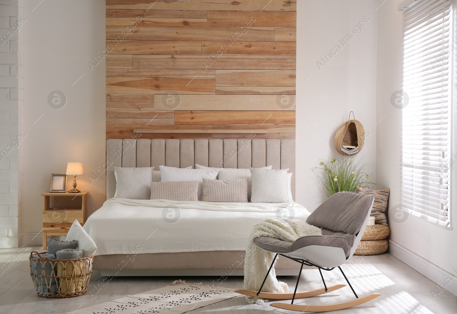 Photo of Stylish room interior with big comfortable bed