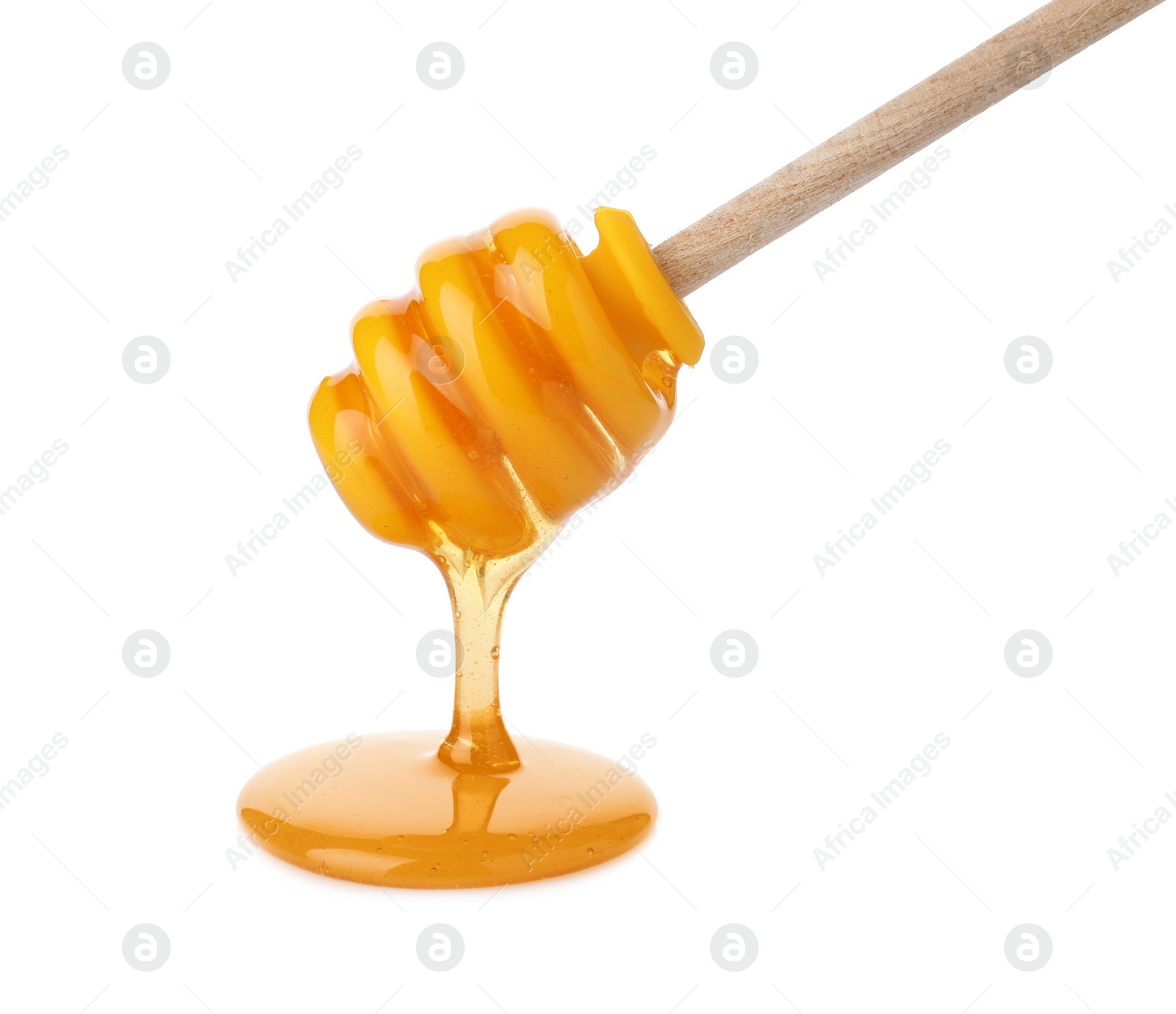 Photo of Honey pouring from dipper isolated on white