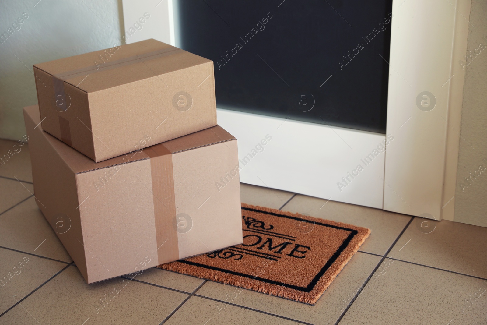 Photo of Parcels delivered on mat near front door