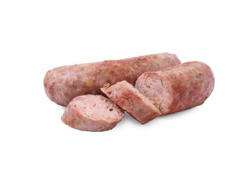 Photo of Tasty whole and cut homemade sausages isolated on white