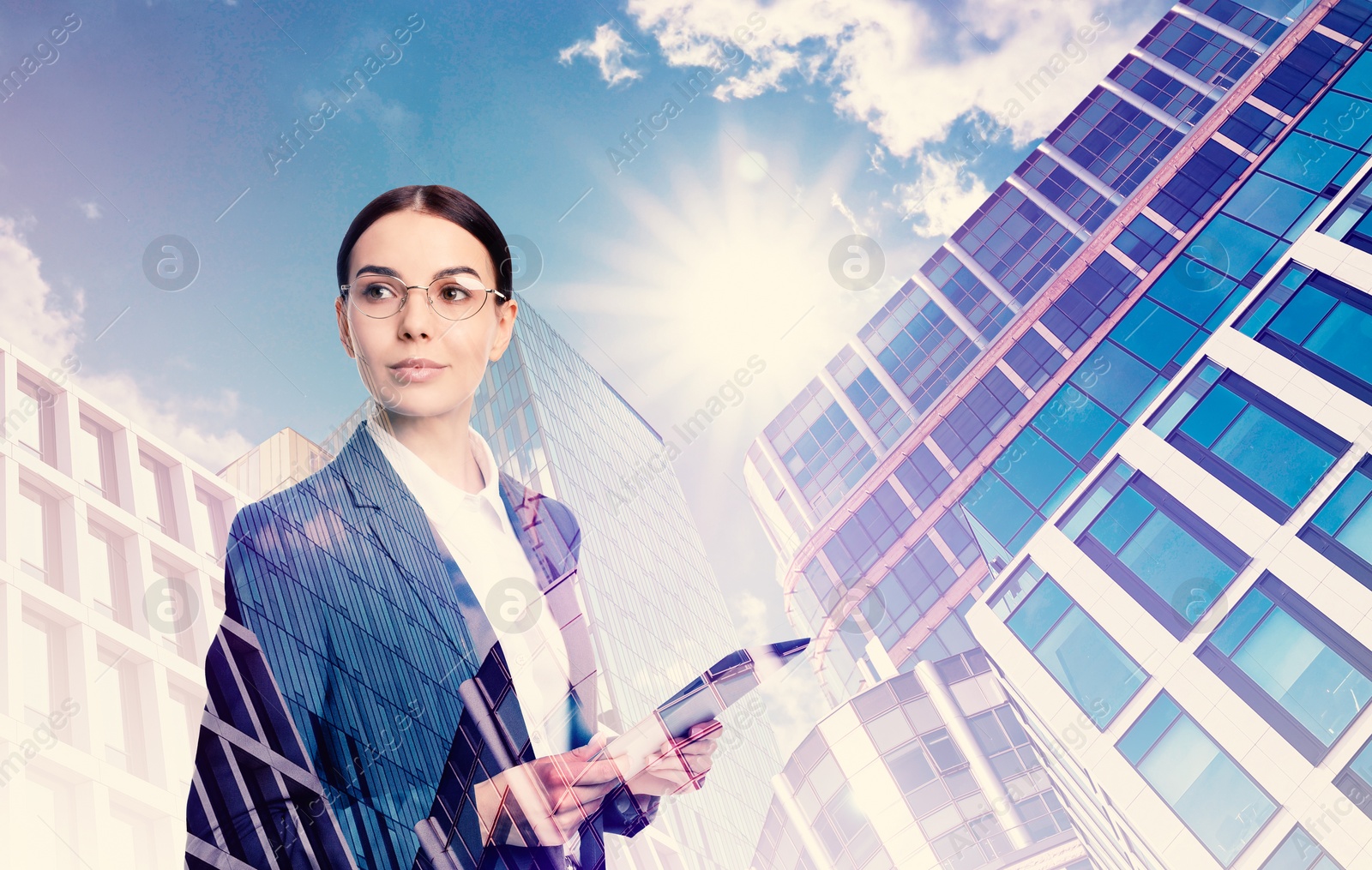 Image of Double exposure of businesswoman and different buildings in city