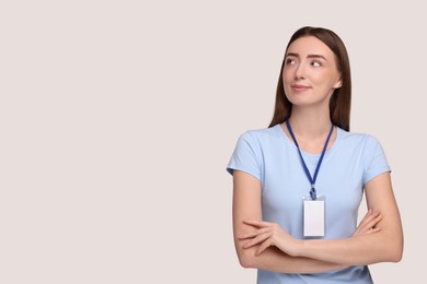 Photo of Woman with blank badge on grey background, space for text