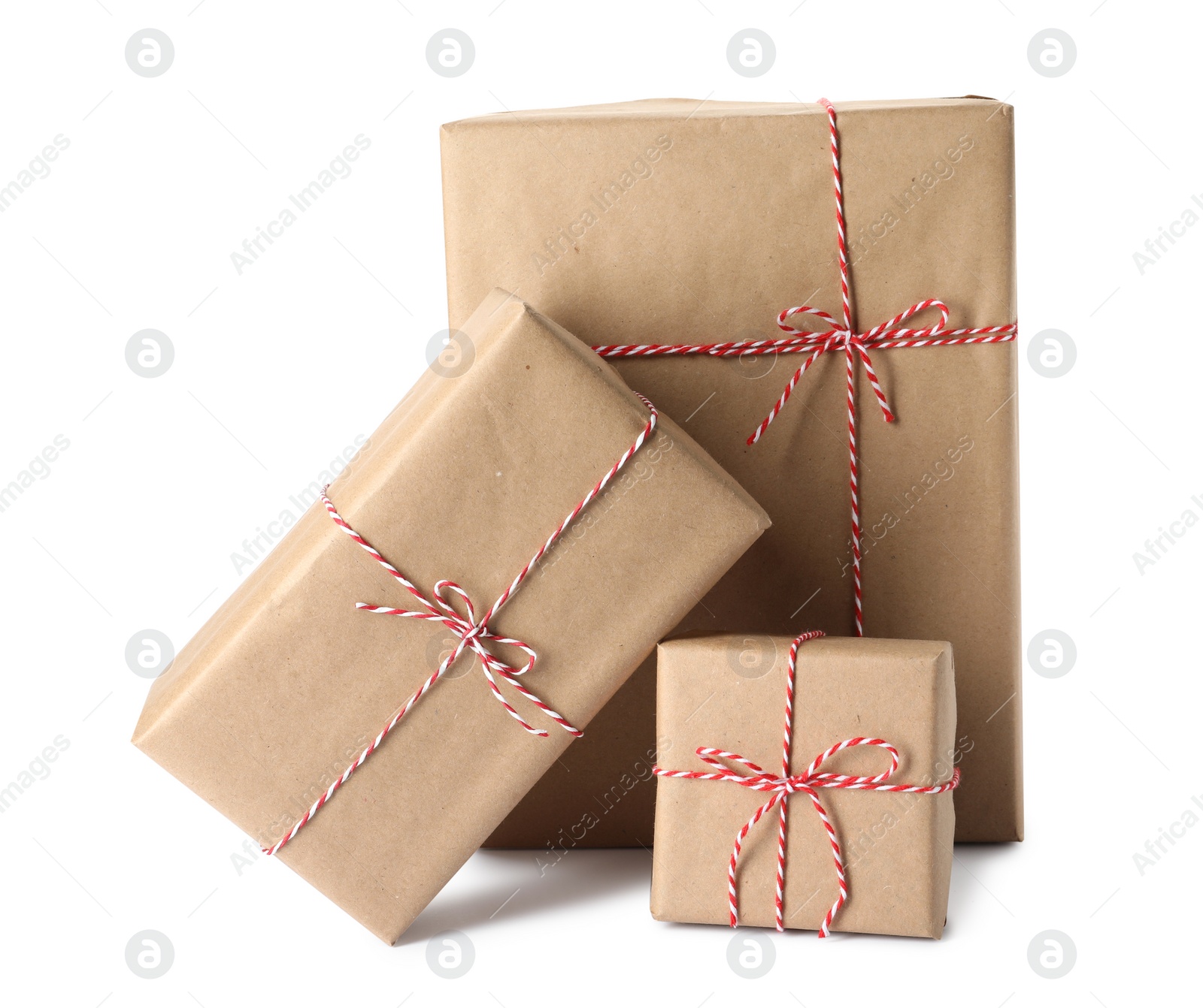 Photo of Gift boxes wrapped in kraft paper with bows on white background