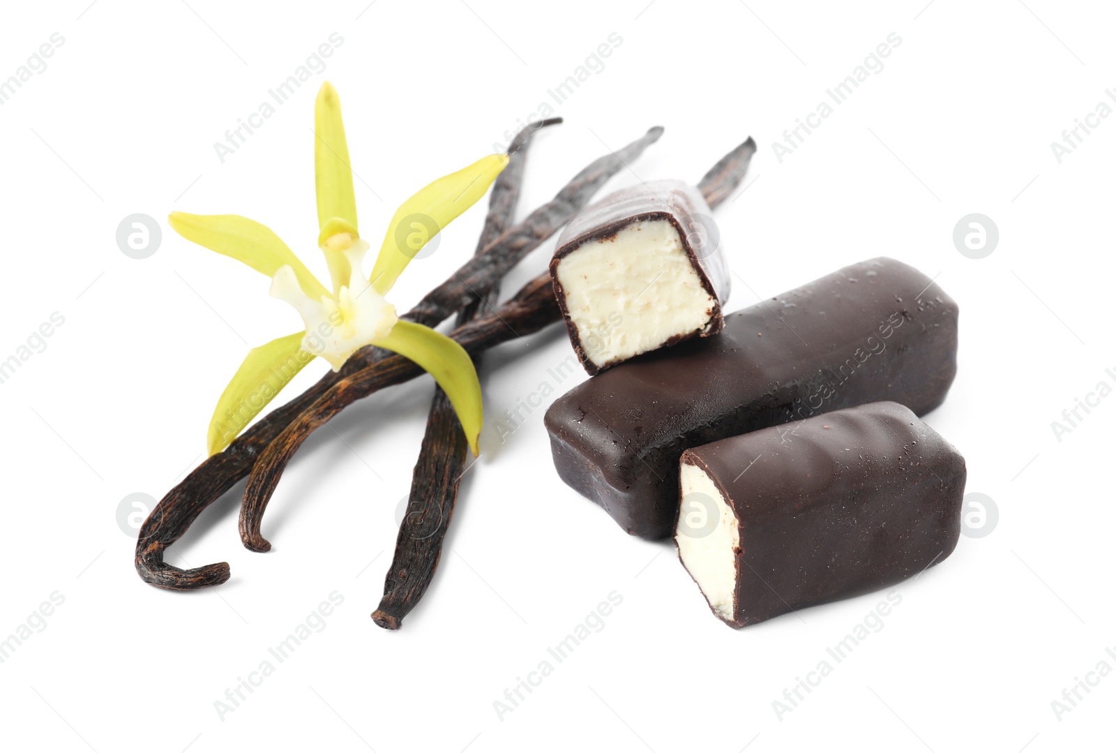 Photo of Glazed curd cheese bars, vanilla pods and flower isolated on white