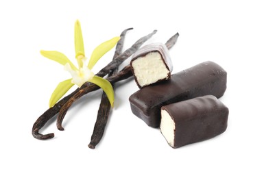 Glazed curd cheese bars, vanilla pods and flower isolated on white