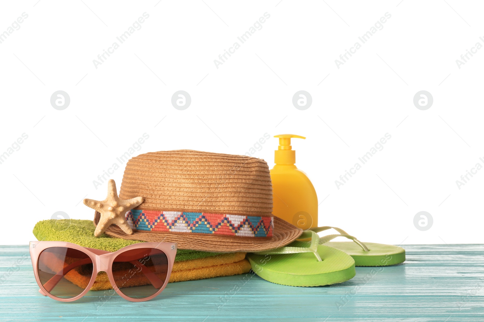 Photo of Set of different beach accessories on table against white background. Space for text