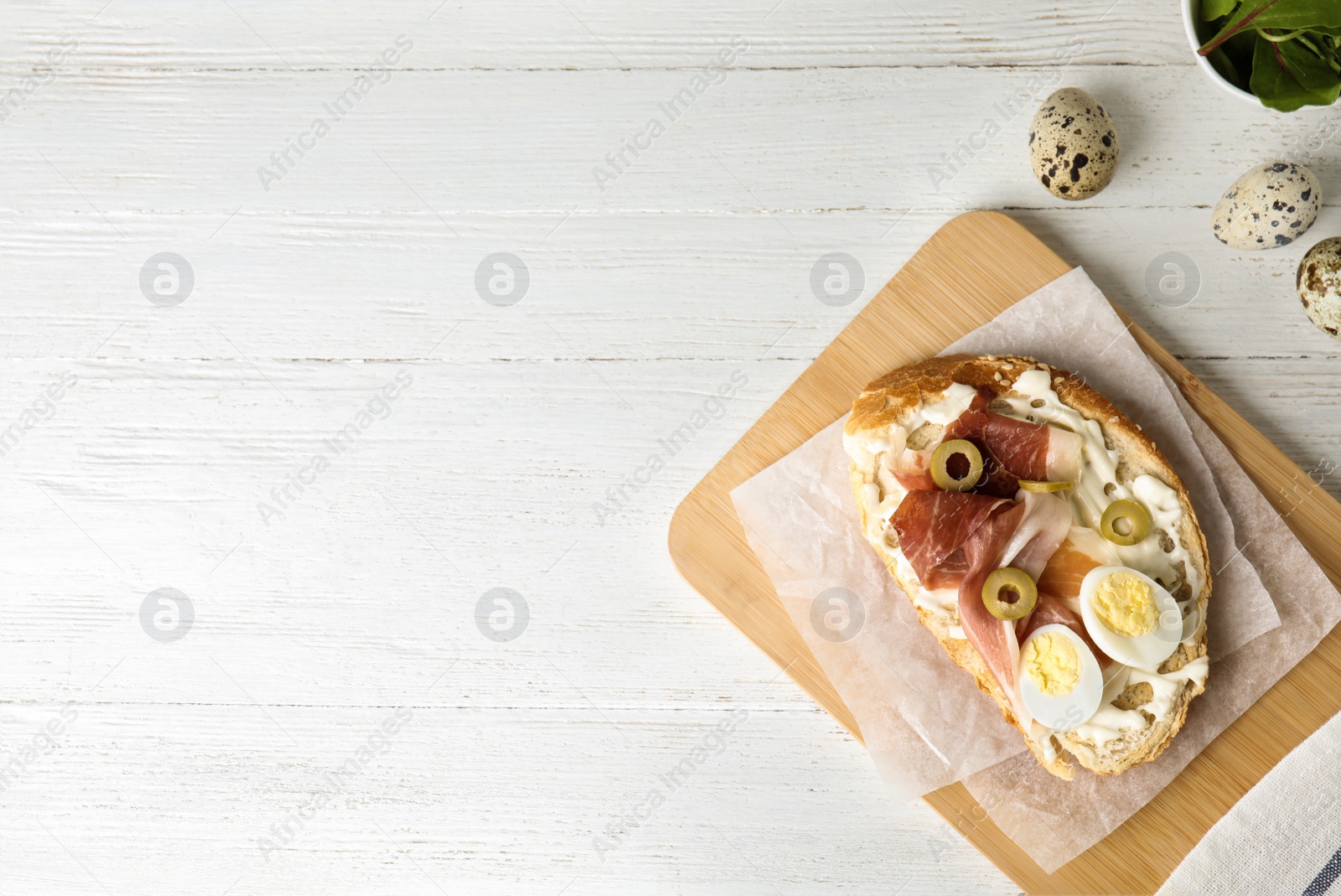 Photo of Flat lay composition with delicious bruschetta on white wooden table, space for text