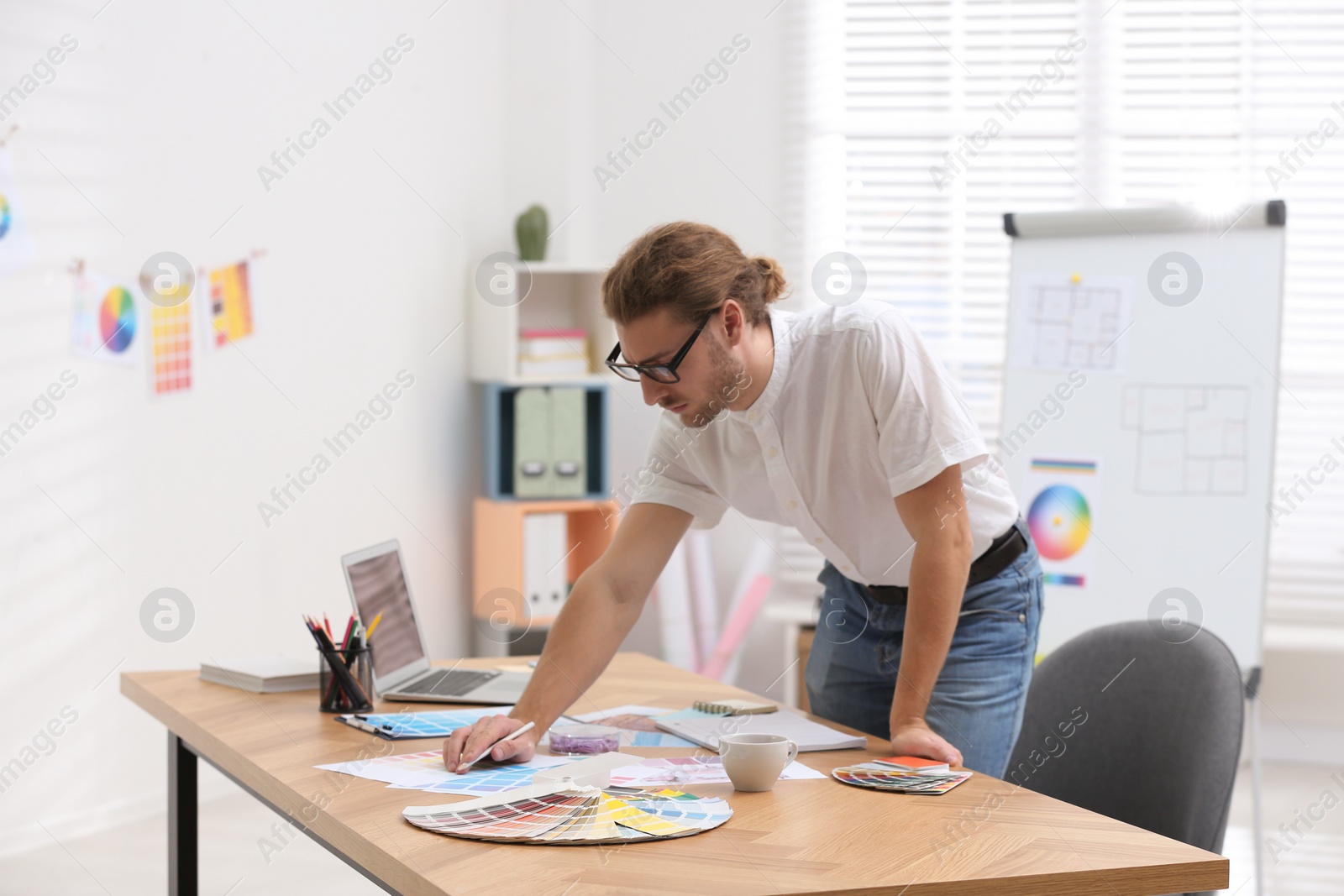 Photo of Professional interior designer at workplace in office