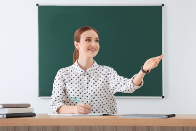 Photo of Portrait of young female teacher in classroom