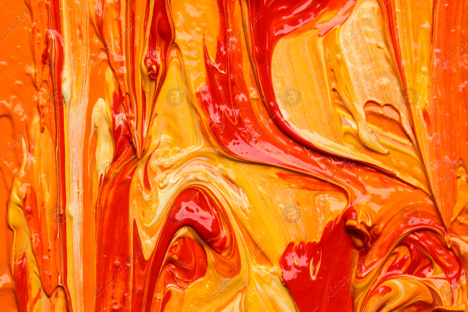 Photo of Beautiful strokes of colorful oil paints as background, closeup