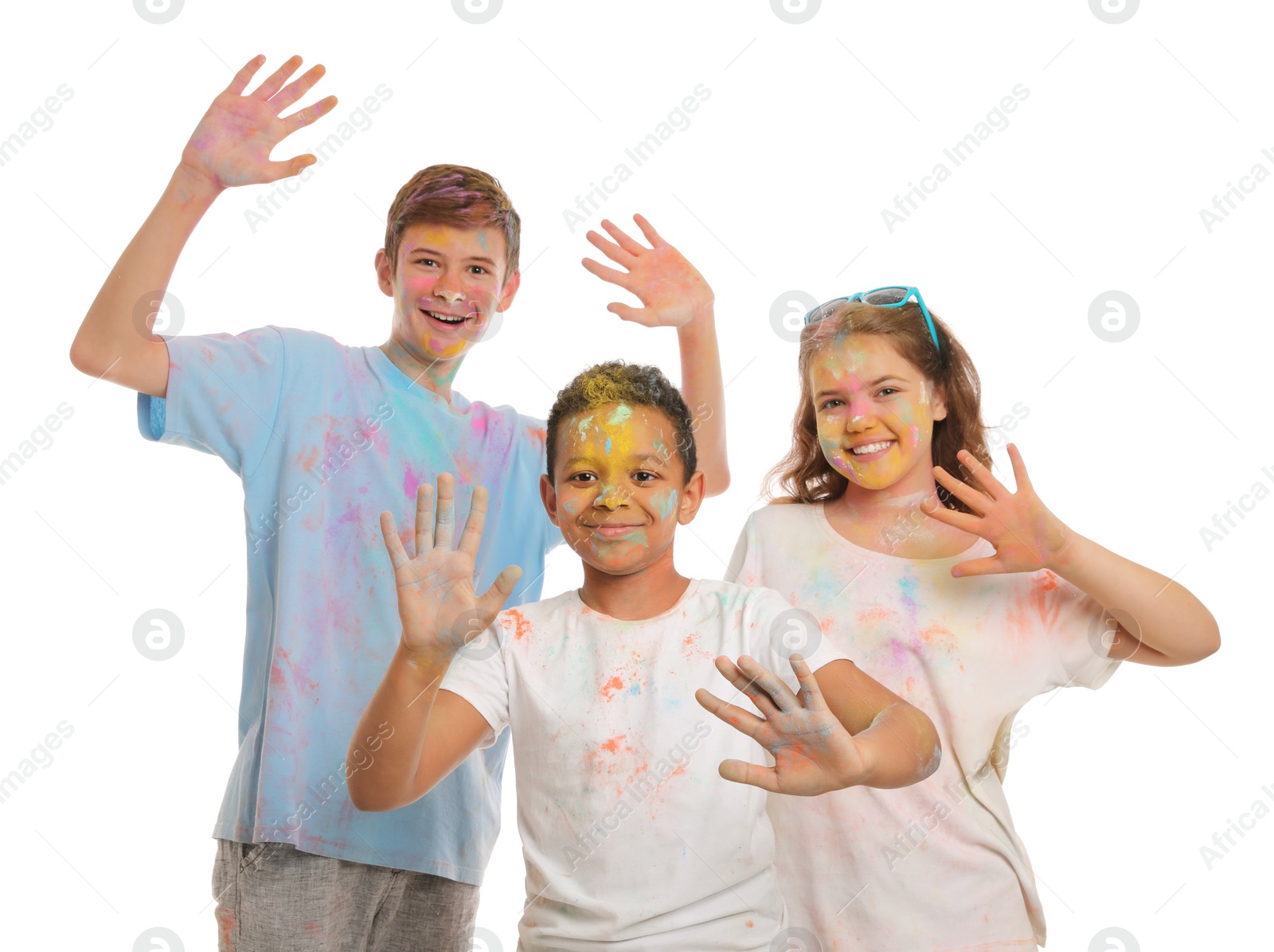 Photo of Group of friends covered with colorful powder dyes on white background. Holi festival celebration