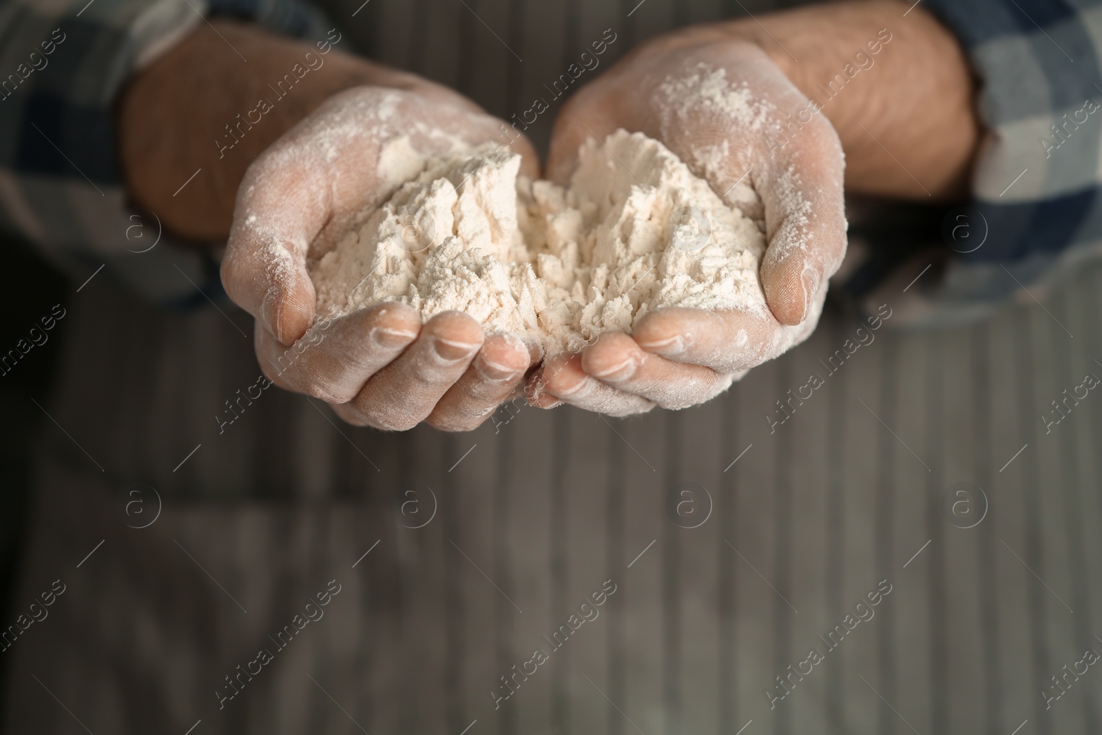 Photo of Man holding flour, closeup