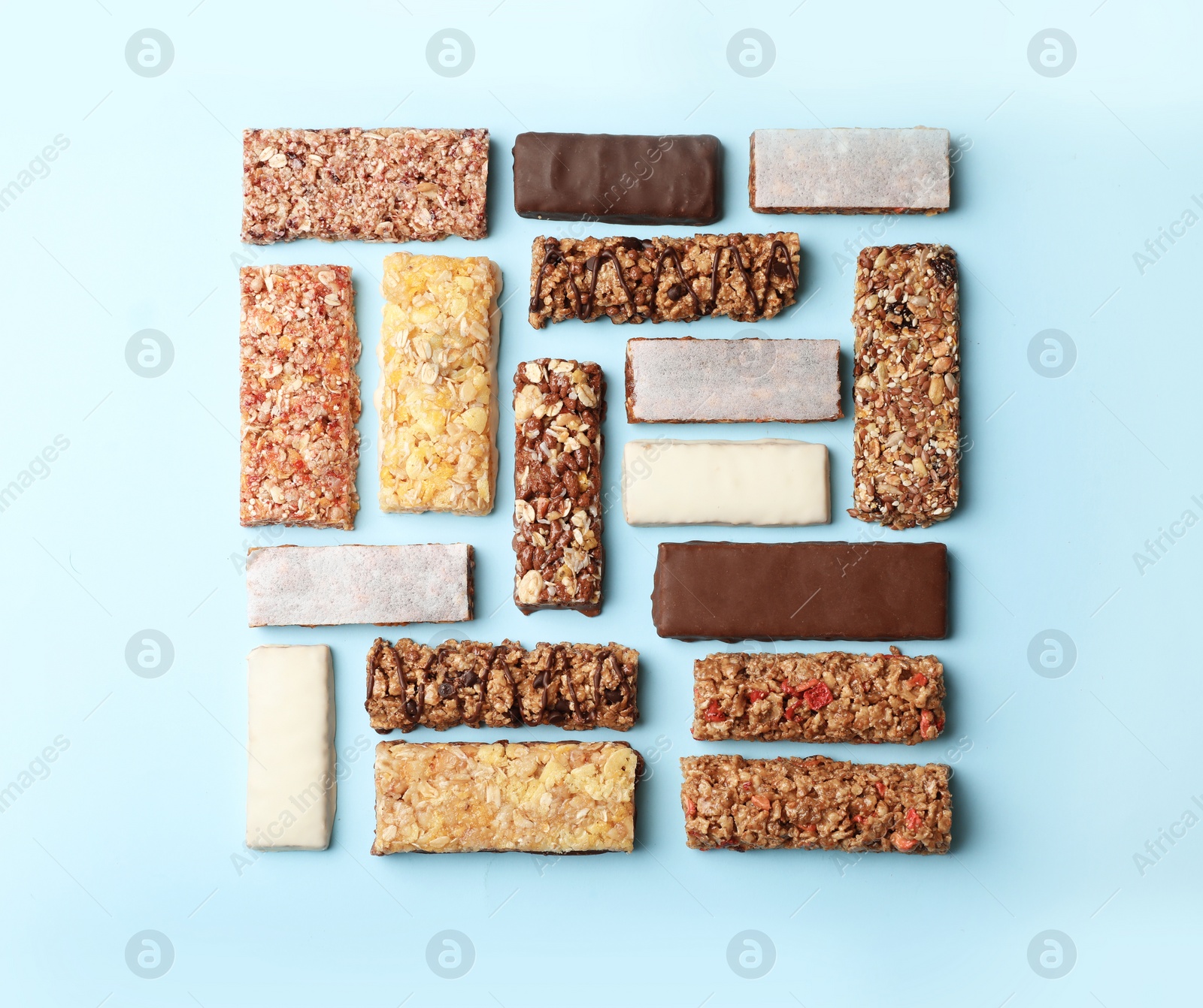 Photo of Flat lay composition with protein bars on color background