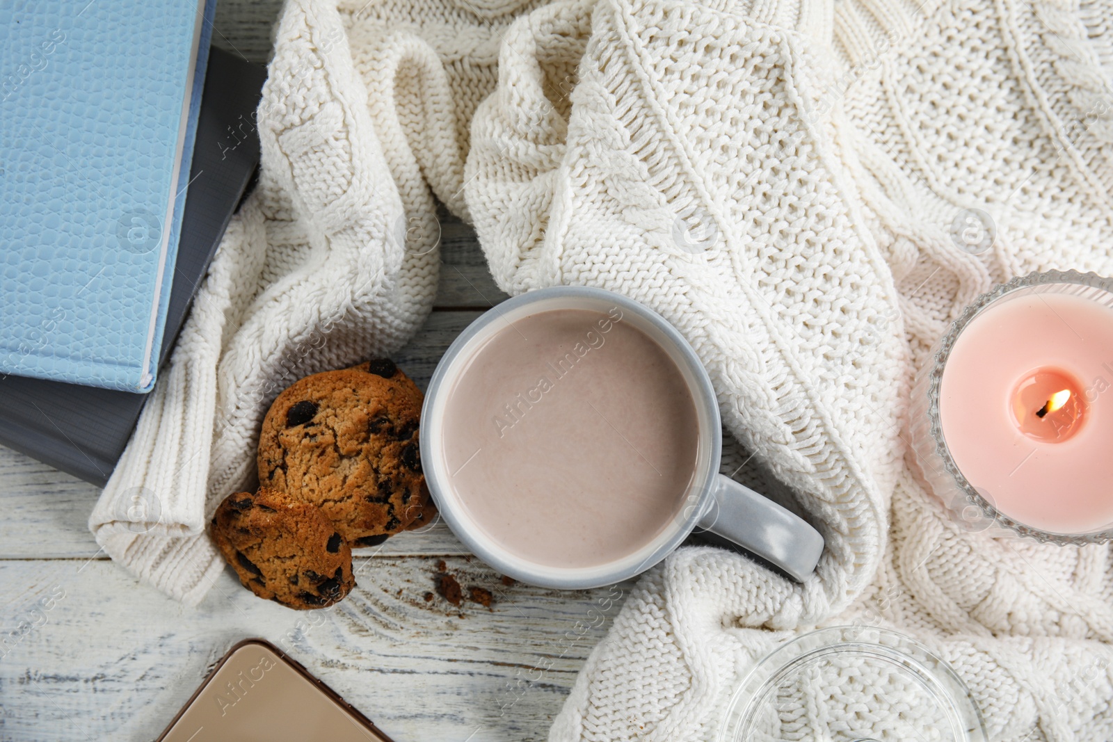 Photo of Flat lay composition with cup of hot cocoa on white wooden table. Winter drink