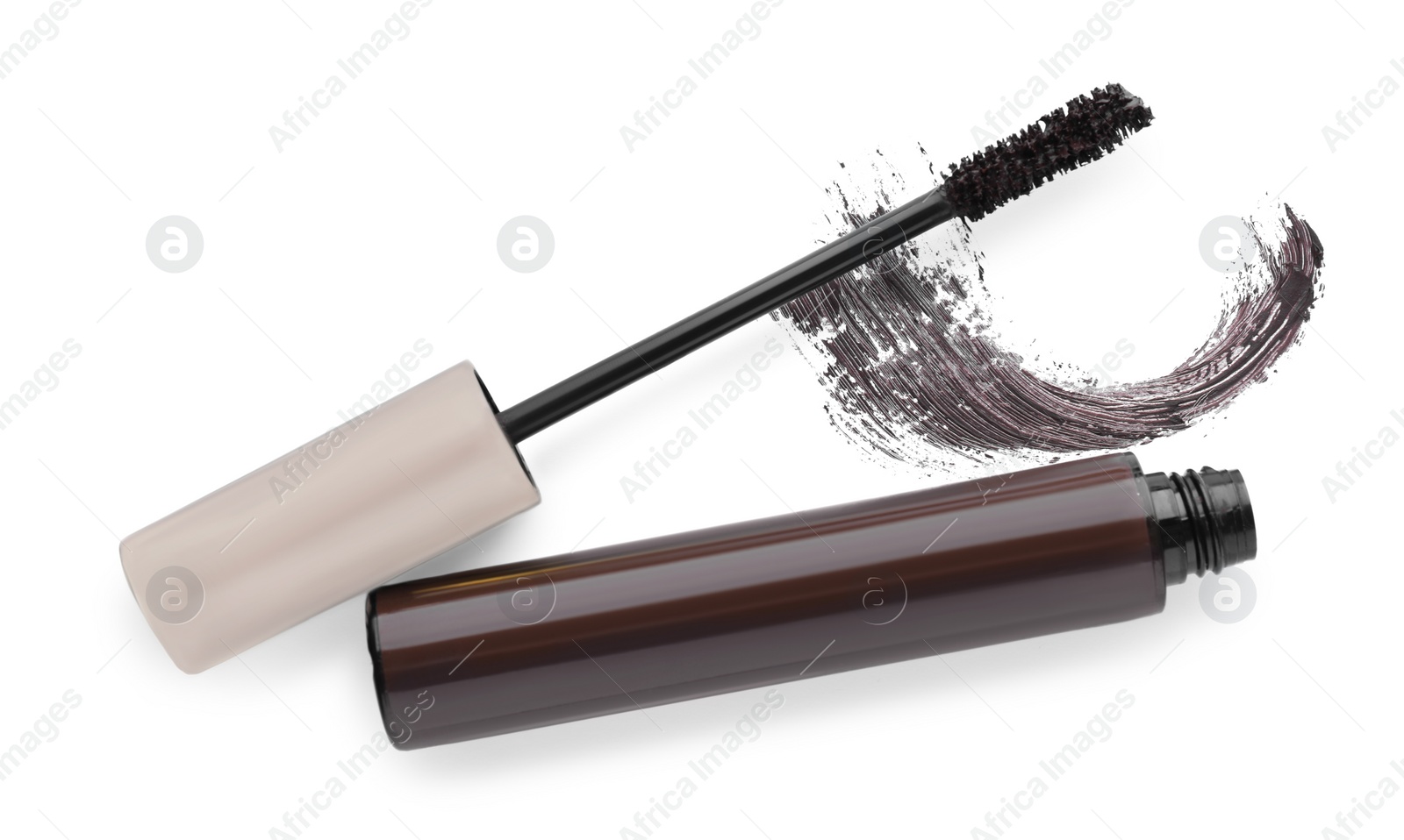 Photo of Tube, brush and brown mascara stroke on white background, top view