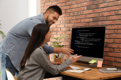 Image of Professional programmers working with computer in office