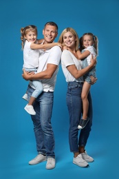 Photo of Happy family with children on blue background