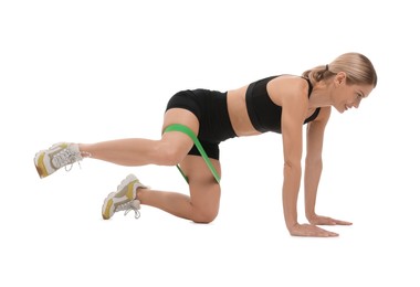 Photo of Woman exercising with elastic resistance band on white background