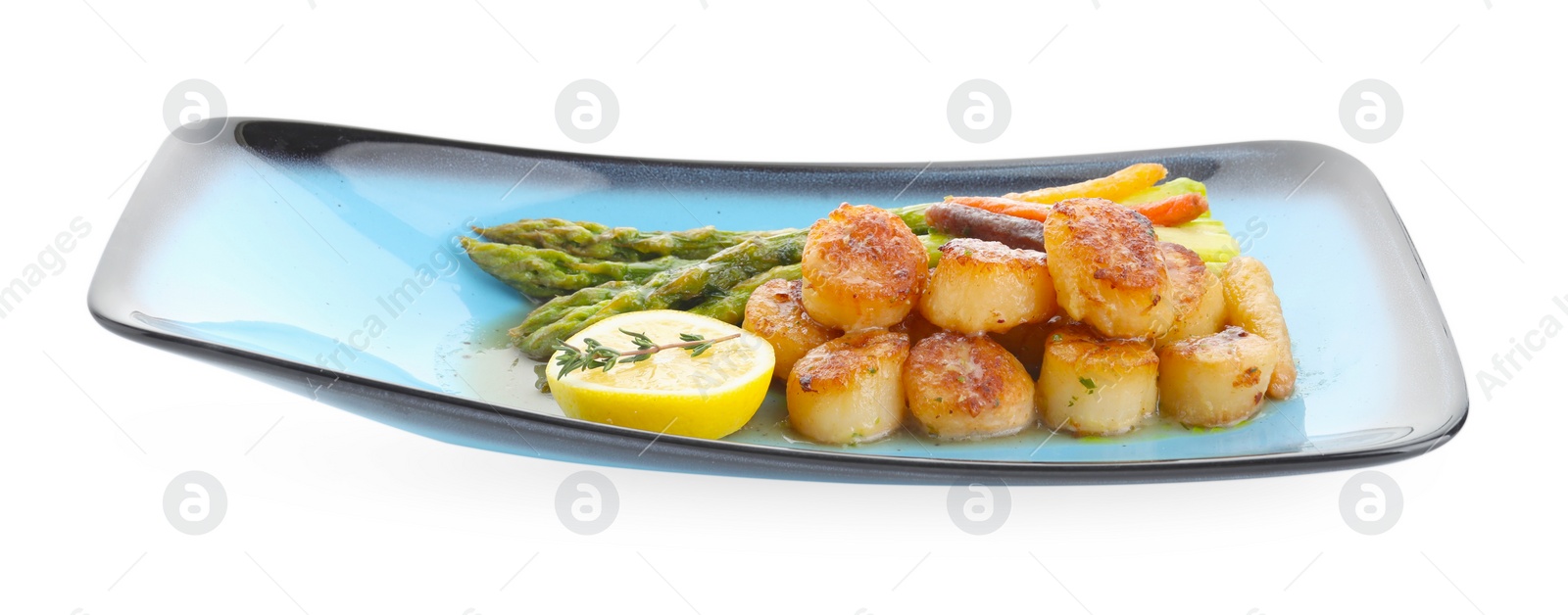 Photo of Delicious fried scallops with asparagus, vegetables, lemon and thyme isolated on white