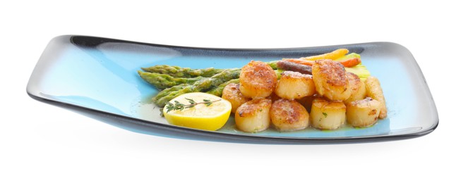 Delicious fried scallops with asparagus, vegetables, lemon and thyme isolated on white