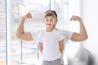 Photo of Dad and his son in gym