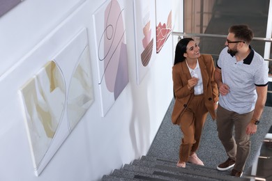 Photo of Happy couple at exhibition in art gallery