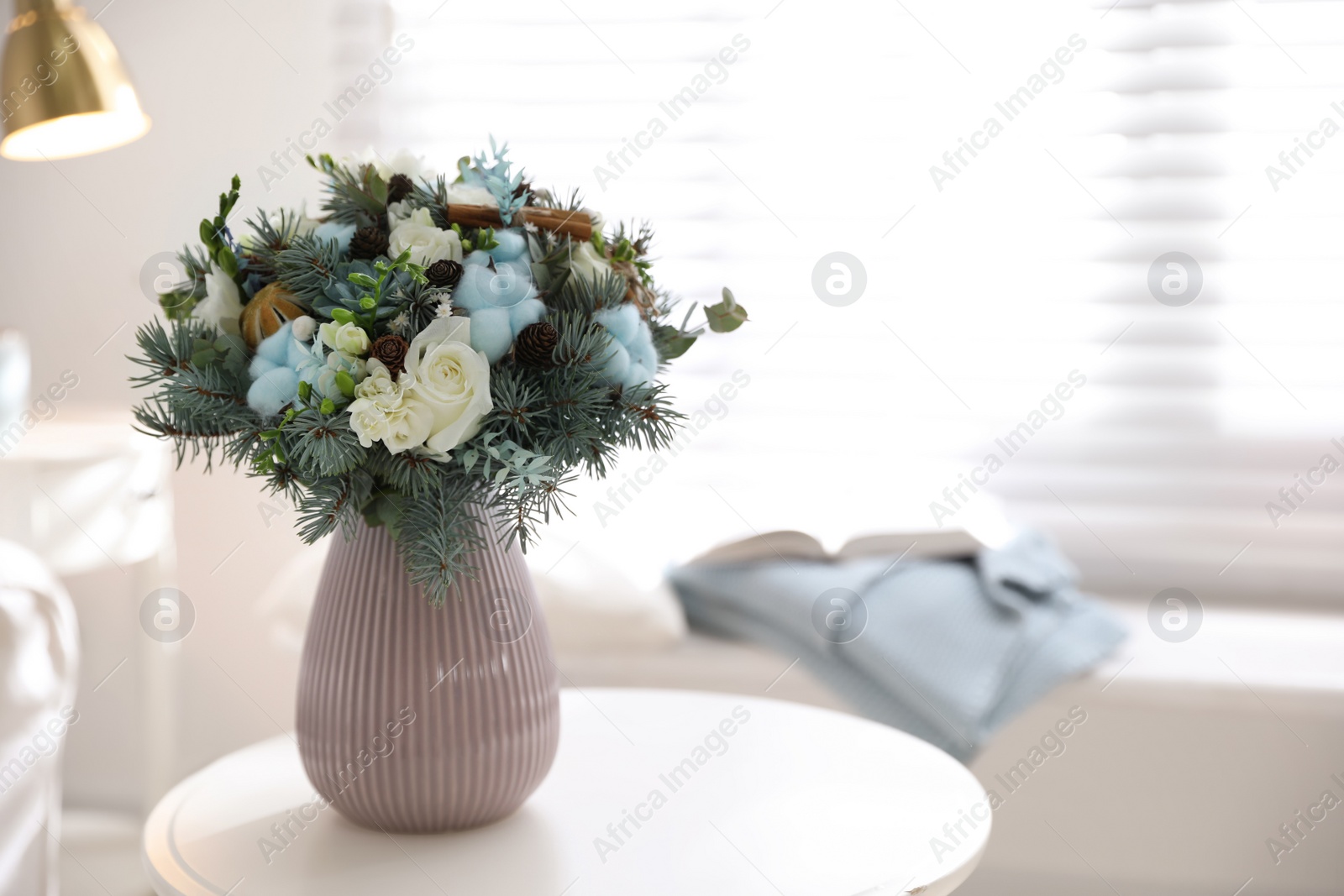 Photo of Beautiful wedding winter bouquet on table indoors. Space for text