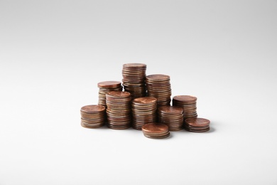 Many stacks of American coins on white background