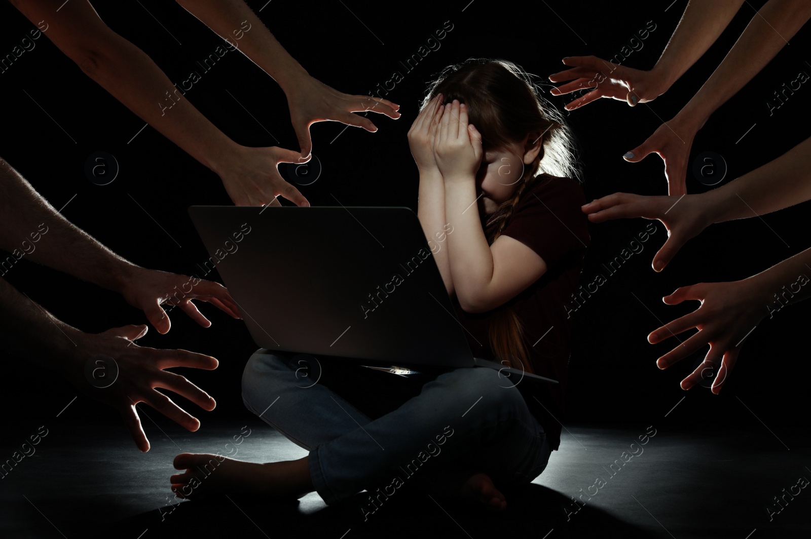 Photo of Strangers reaching frightened little child with laptop on dark background. Cyber danger