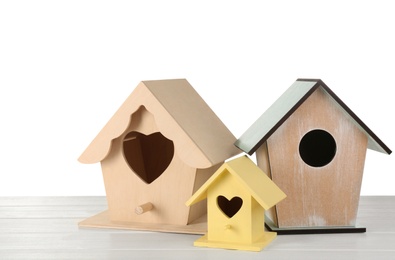 Three different bird houses on white background