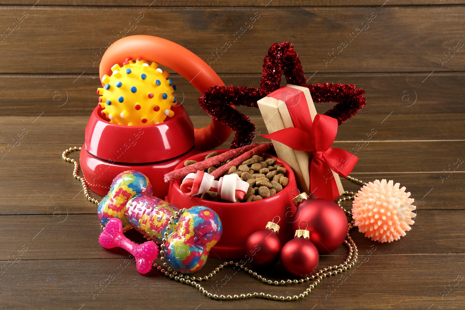 Photo of Different colorful pet shop goods on wooden background