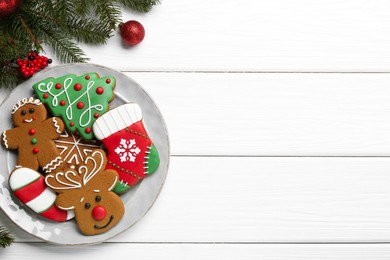 Photo of Tasty homemade Christmas cookies on white wooden table, top view. Space for text