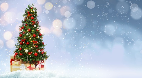 Image of Beautiful decorated Christmas tree on light background, space for text. Banner design