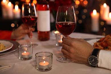 Photo of Couple having romantic dinner in restaurant, closeup