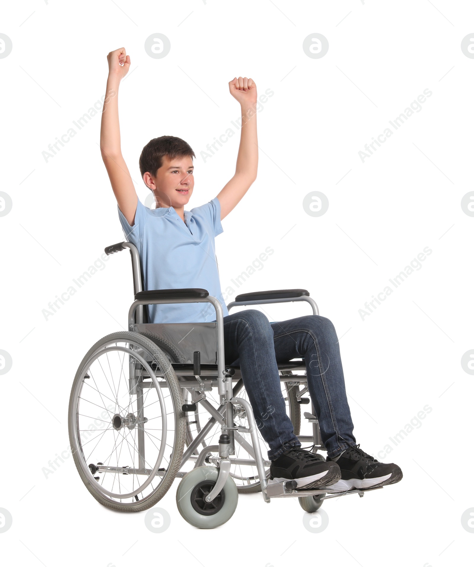 Photo of Teenage boy in wheelchair on white background