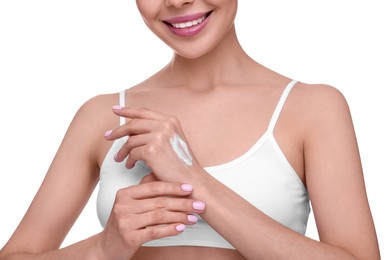 Woman with smear of body cream on her hand against white background, closeup