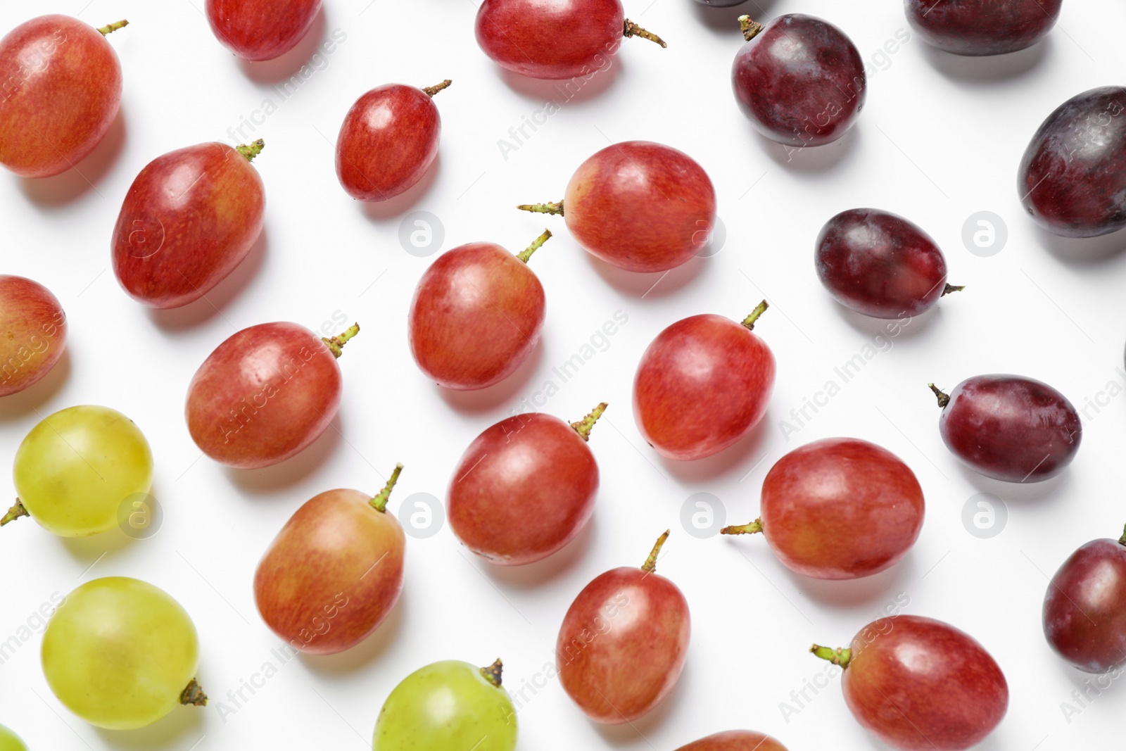 Photo of Fresh ripe juicy grapes on white background, top view