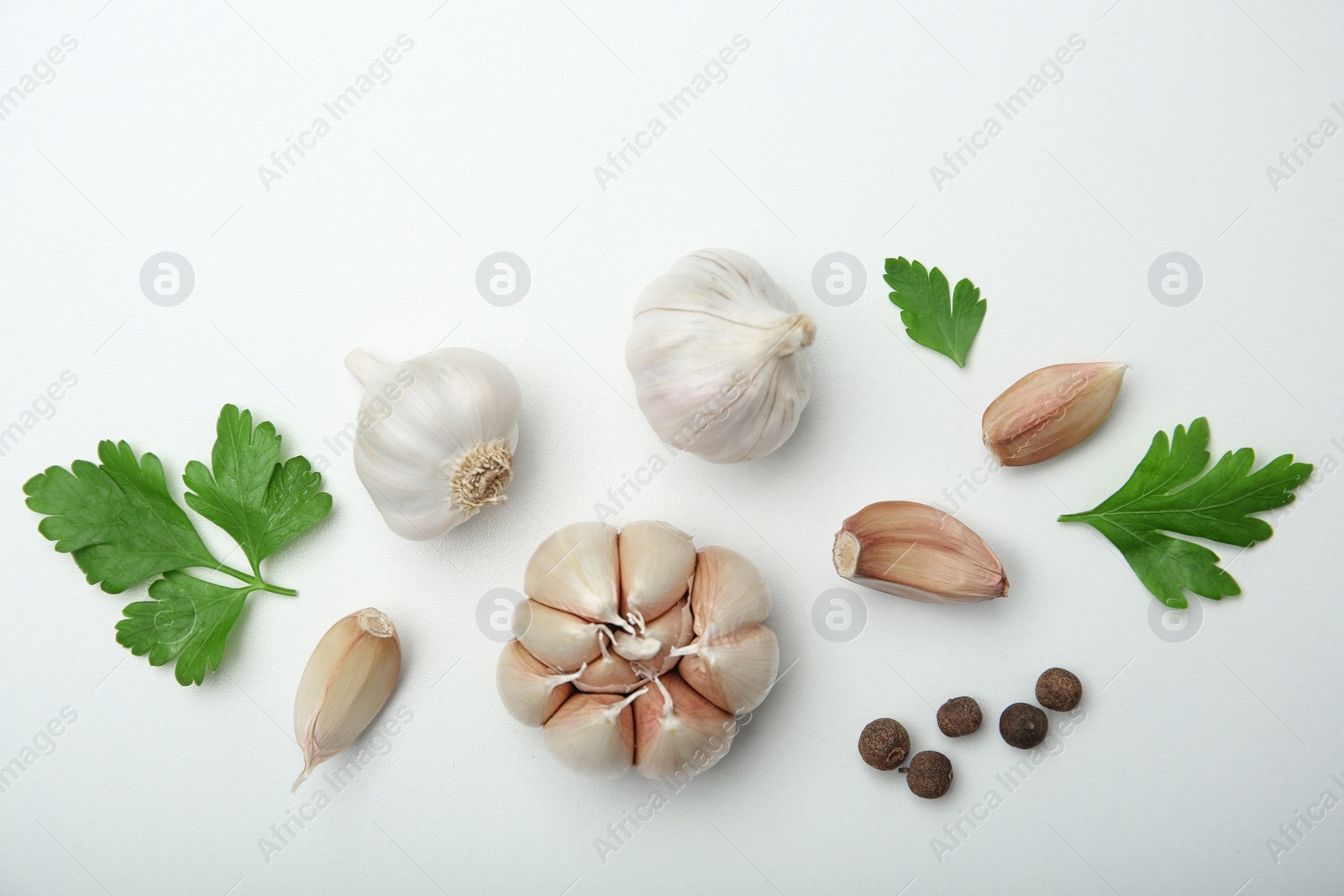 Photo of Flat lay composition with garlic on light background