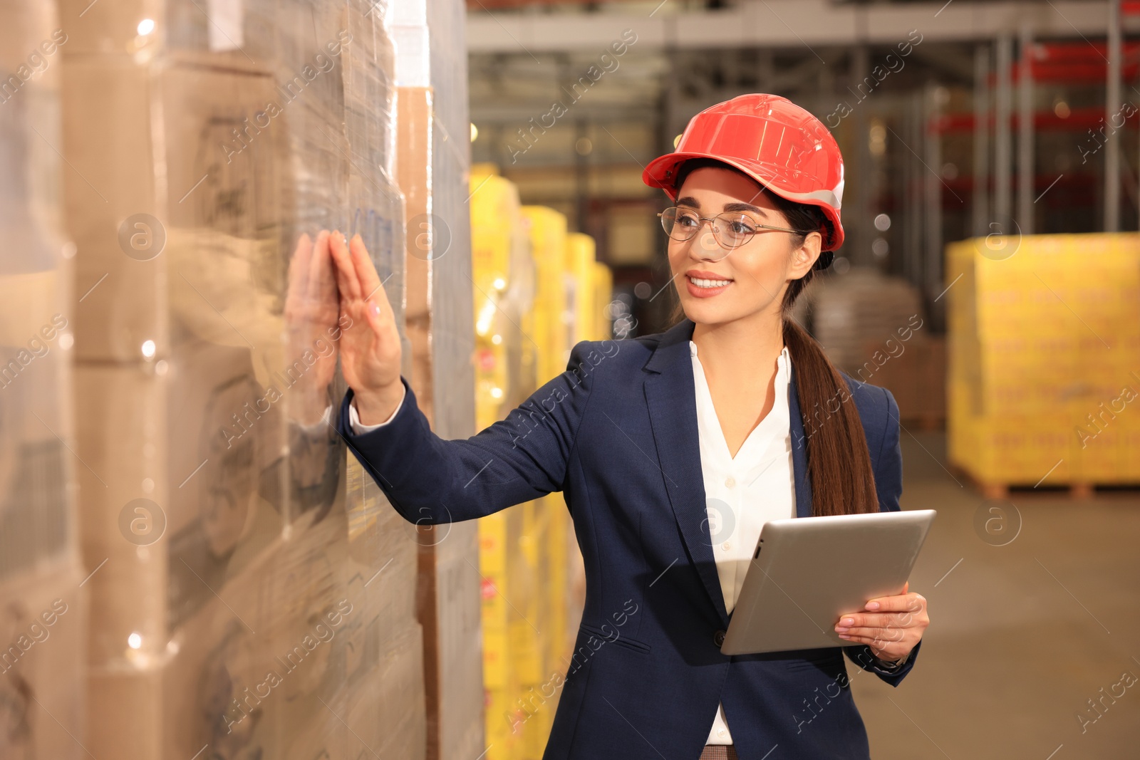 Image of Manager with tablet working at warehouse. Logistics center