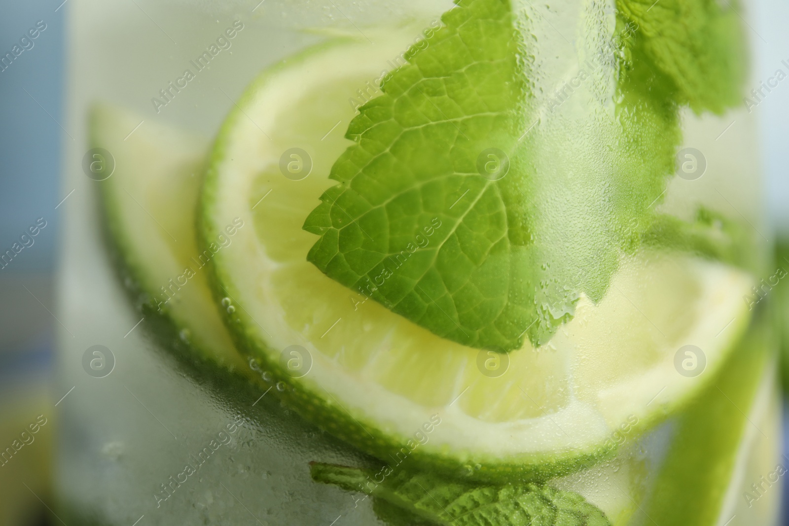 Photo of Delicious fresh mojito in glass, closeup view