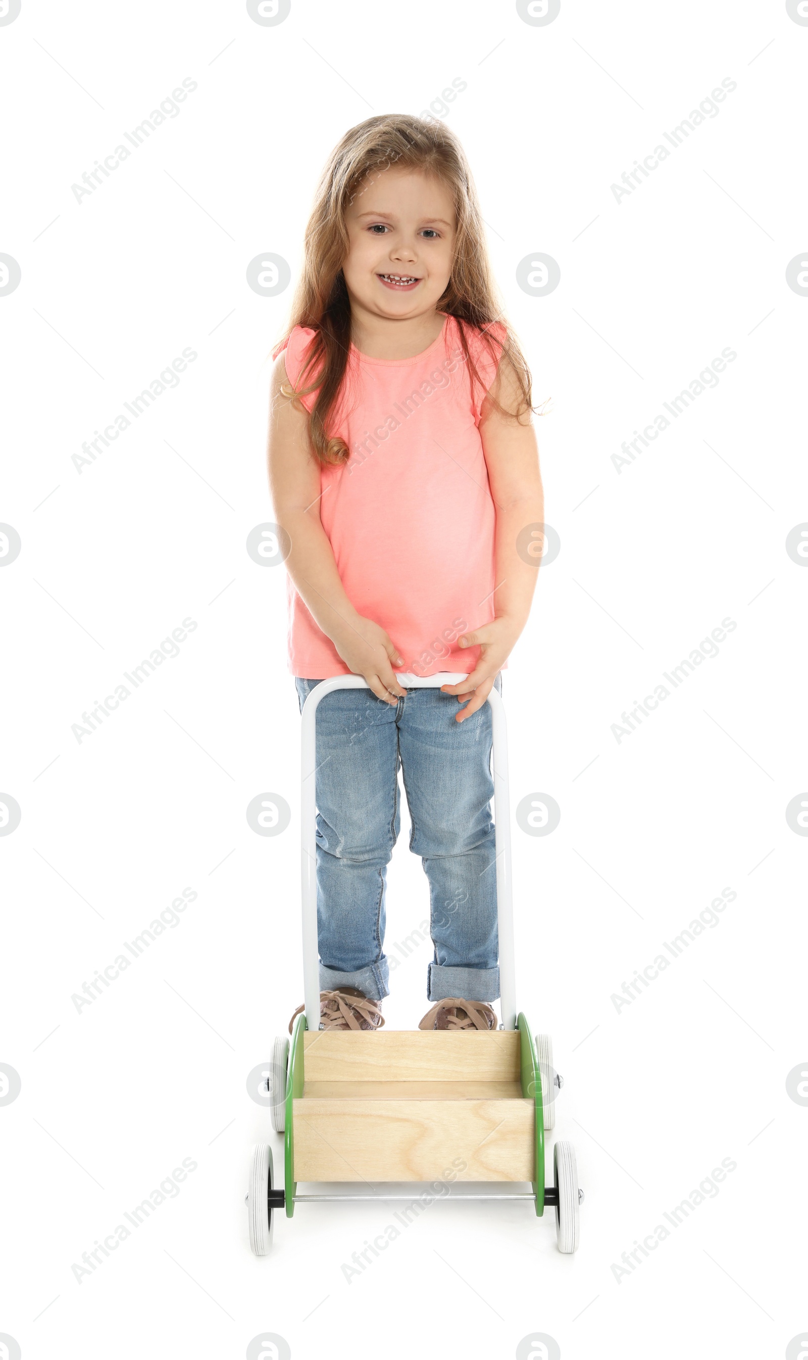 Photo of Pretty little girl with wooden cart against white background