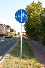 Photo of Traffic sign compulsory track for pedestrians and bicycles on city street
