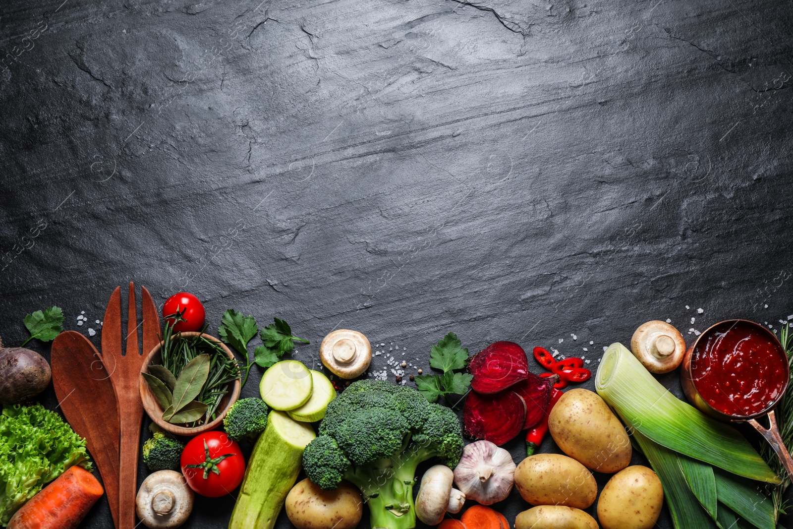 Photo of Flat lay composition with fresh products on grey table, space for text. Healthy cooking