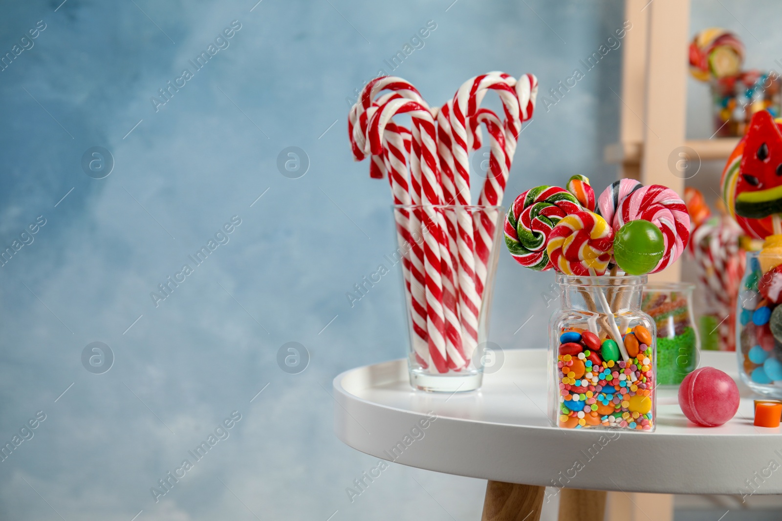 Photo of Composition with many different candies on table. Space for text