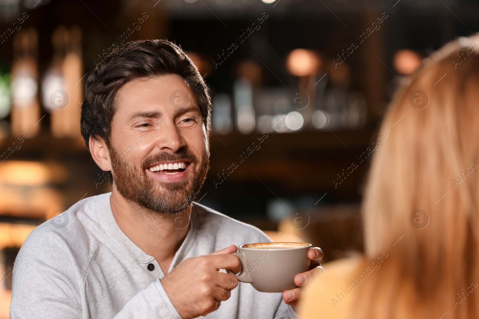 Photo of Romantic date. Happy couple spending time together in cafe