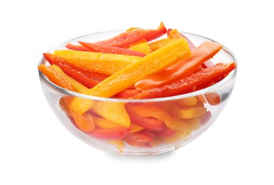 Photo of Cut fresh bell peppers in glass bowl isolated on white