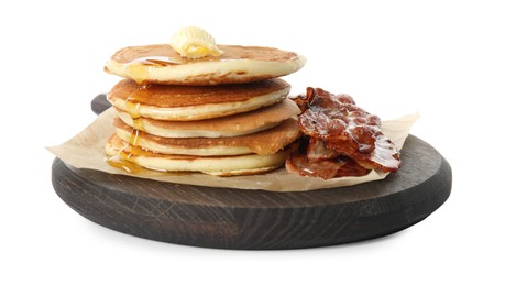 Delicious pancakes with maple syrup, butter and fried bacon on white background