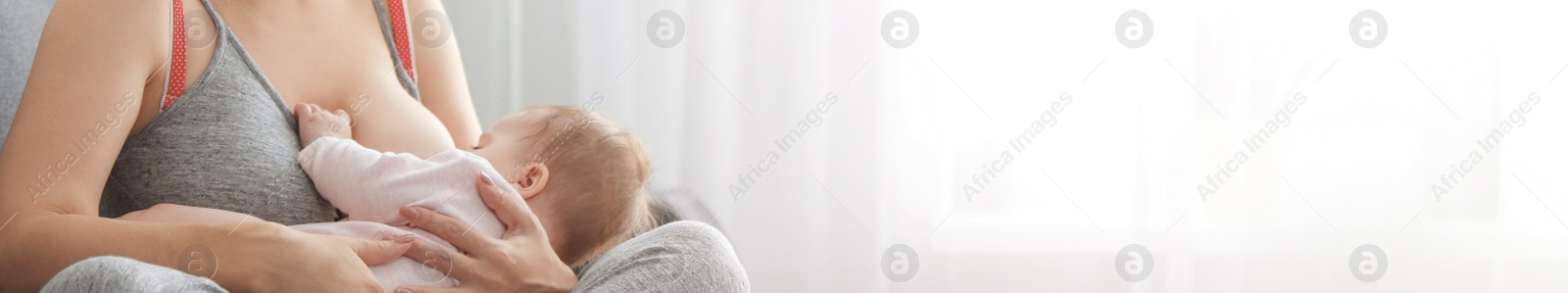 Image of Young woman breast feeding her little baby at home, space for text. Banner design