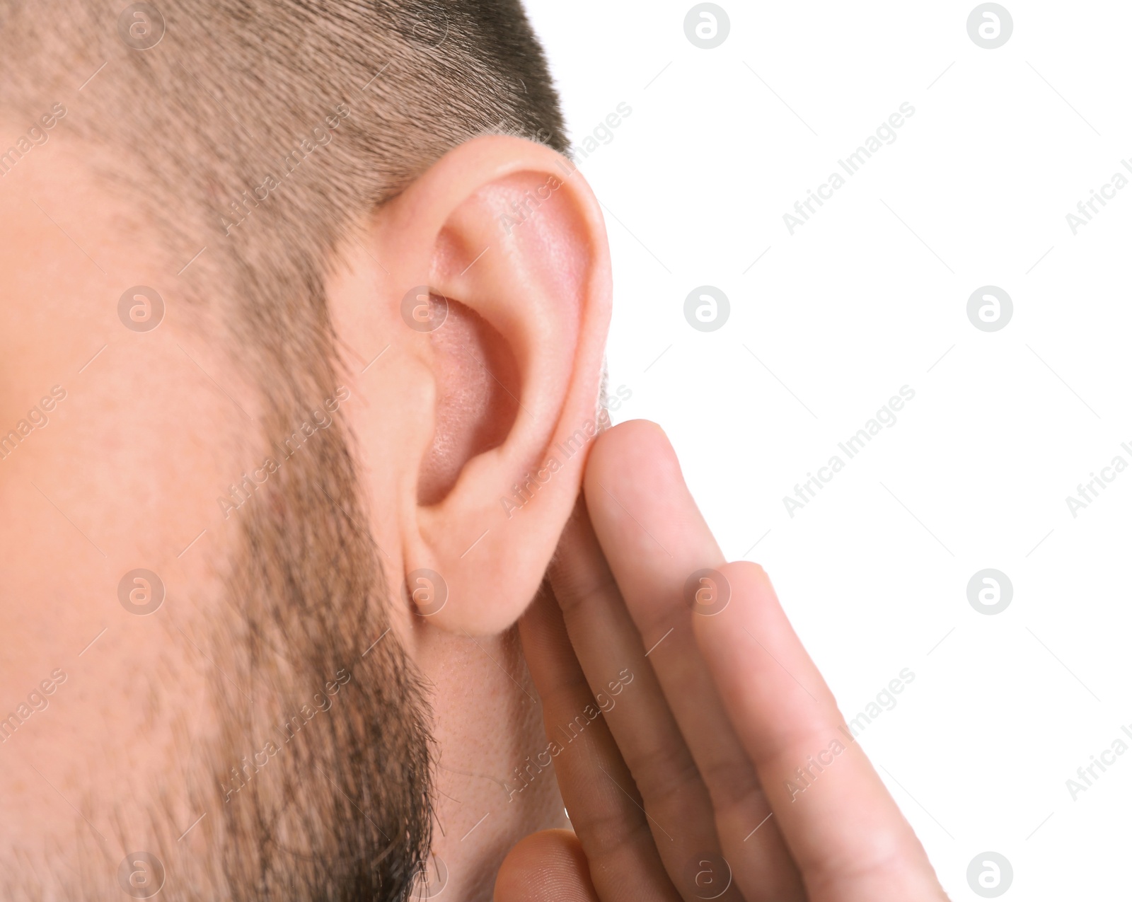 Photo of Young man with hearing problem on white background, closeup